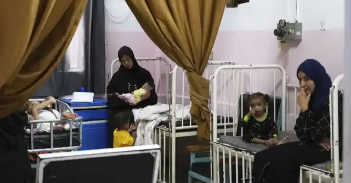 Mayar Al-Arja, 2, right, and 5-month-old Yousef Al-Najjar, both suffering from malnutrition, are cared for by their mothers in a clinic in Nasser Hospital, Khan Younis, Gaza, on Wednesday, May 21, 2025. (AP Photo/Abdel Kareem Hana)